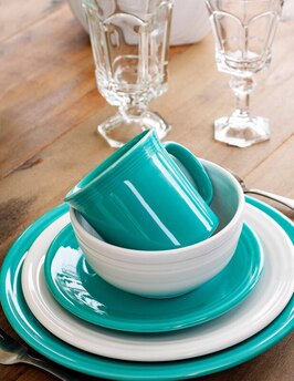 Stacked place setting of dishes